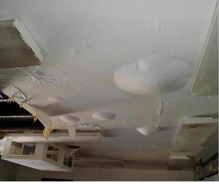 white ceiling with water damage bubbles 