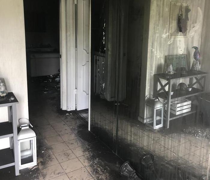 Living room with smoke and soot damage