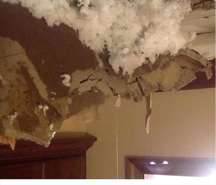 broken water damaged ceiling with pieces falling 